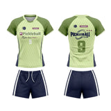 Custom light green and navy short sleeve pickleball apparel set with raglan sleeves, number 9, and matching athletic shorts.