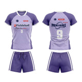 Custom purple and white short sleeve V-neck pickleball apparel set with diagonal stripe pattern, number 9, and shorts.