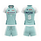 Custom teal and white short sleeve V-neck pickleball apparel set featuring club logo, number 9, and side stripe shorts.