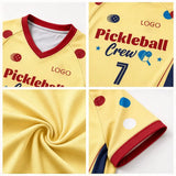 Close-up details of yellow custom pickleball apparel showing V-neck collar, chest print, breathable fabric, and sleeve hem.